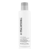 A bottle of Paul Mitchell Soft Style Foaming Pomade. The bottle is white with a grey label and Paul Mitchell branding.